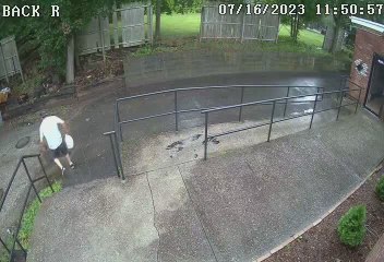 Man Slips on Puddle of Water