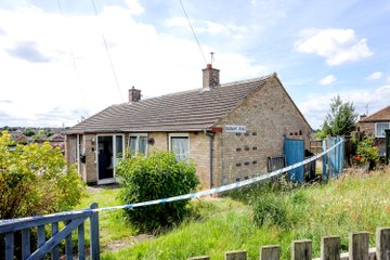 Five men arrested after woman's body discovered at bungalow