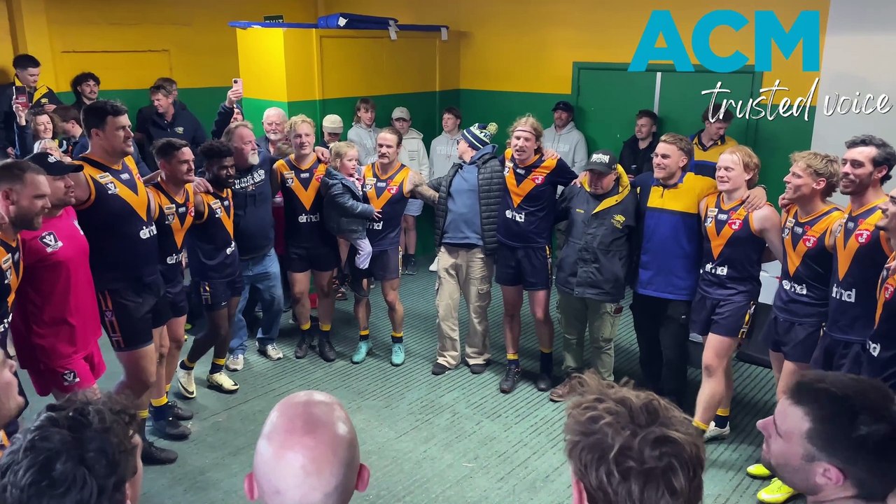 The Nhill Tigers' senior footballers sing the club song after its round 11 WFNL win over Dimboola