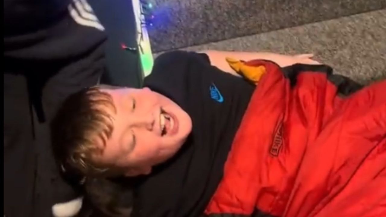 Playful stair-sliding game unites generations in a joyful family moment