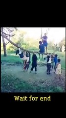 Children turning tree branch into gandal as