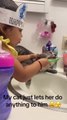 Kid Tries to Brush Cat's Teeth