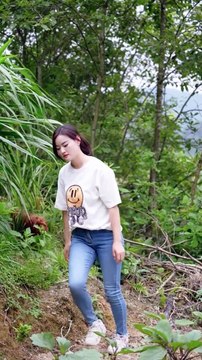 Smiling Woman with Small Dog Harvesting Watermelon: Garden Fresh
