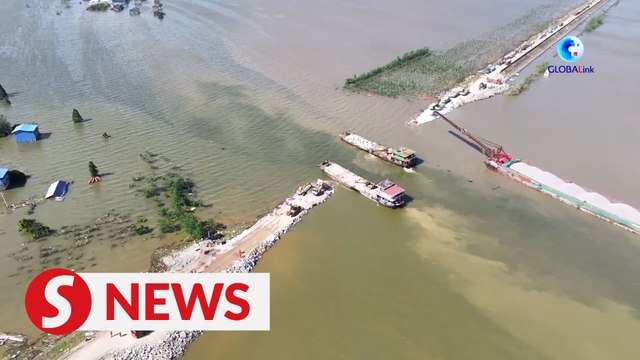 Floodwater drainage underway after dike breach sealed at China's second-largest freshwater lake