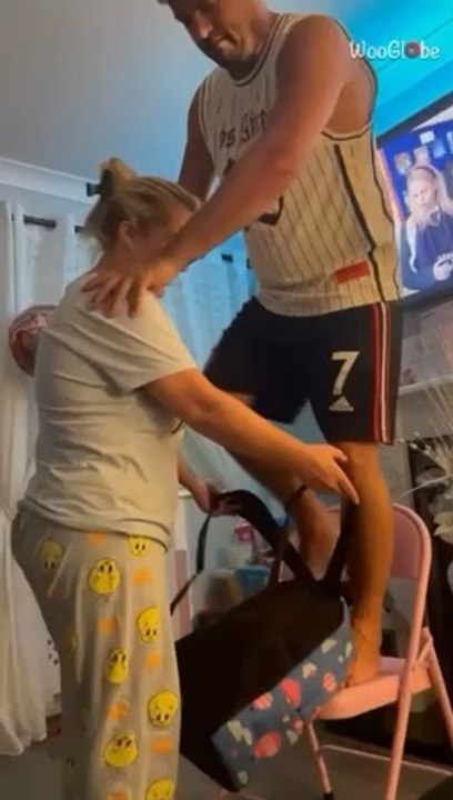 Joyful mishap: Playful attempt at a piggyback ride turns into a hilarious fall