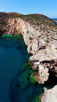 Rate the dive at the end _You can_t miss this place if you visit Ios_ Greece__._Found this epic cliff jumping spot on my recent trip to Ios where the water looks like Powerade. The boat ride there was pretty wild due to the strong winds in(