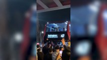 Excited England fans dance around “Bellingham” bus