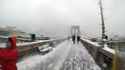 Bike from the Brooklyn Bridge to Manhattan on a snowy day