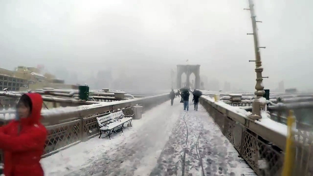 Bike from the Brooklyn Bridge to Manhattan on a snowy day