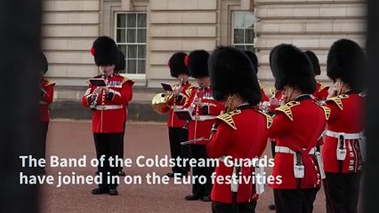 It's coming home: Guards play 'Three Lions' at Buckingham Palace