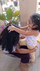 Removing Mama's white hair.