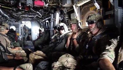 Brave Soldiers Descend from Sky onto Aircraft Carrier amidst Endless Ocean