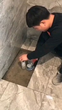 Installing tiles in washroom