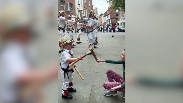 Two-year-old boy dances along with father’s Morris dance group