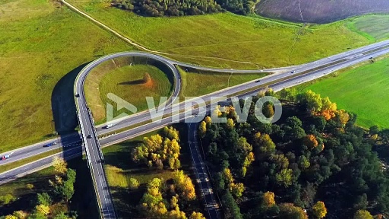 View from above cars driving on road junction