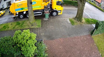 Garbage Truck Collects Garbage Bin Along With Trash