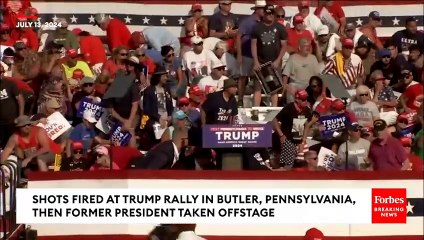 Download Video: BREAKING NEWS: Shots Fired At Trump Rally Former President Pumps Fist As Hes Rushed Off Stage