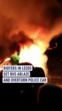 Police car flipped over and bus on fire in Leeds as riots break out