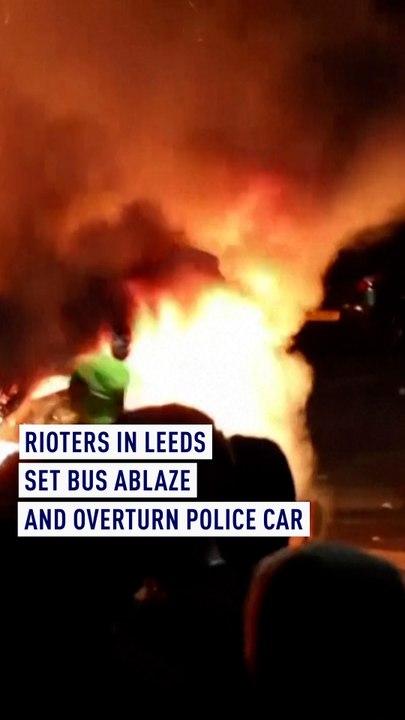 Police car flipped over and bus on fire in Leeds as riots break out
