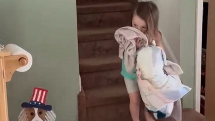 Adorable kid happily joins her beloved doggo in its cage