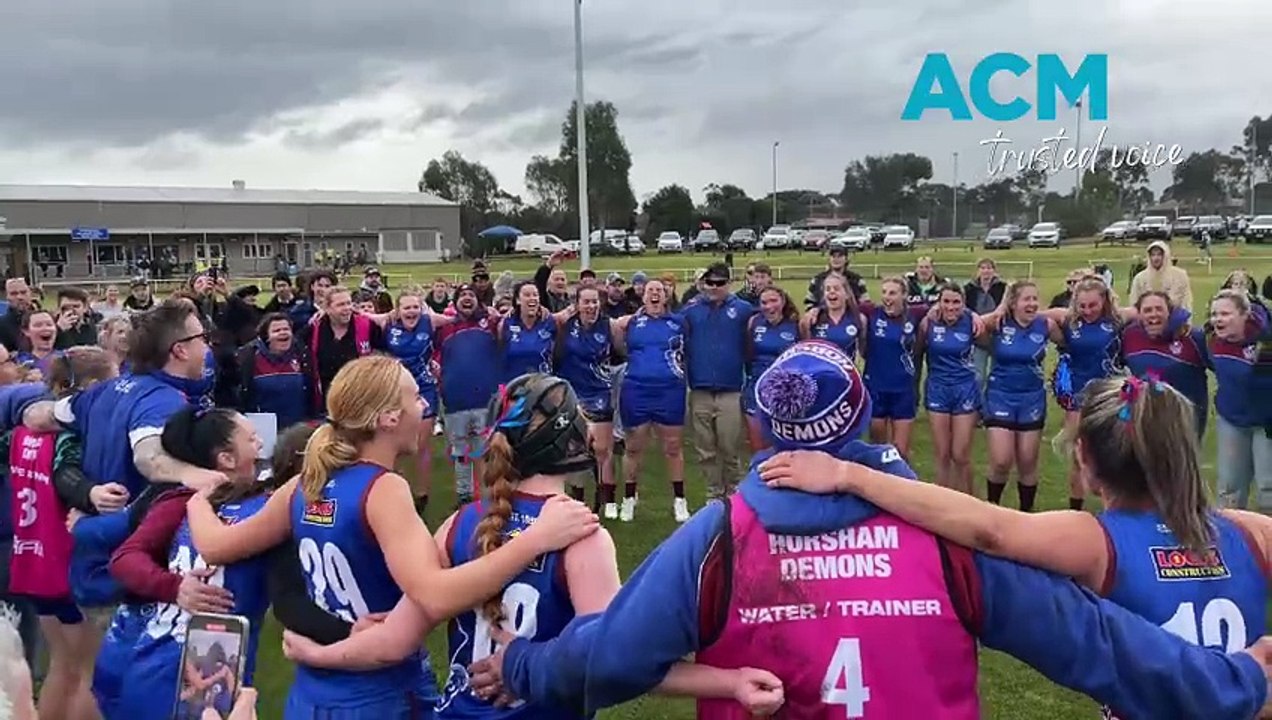 The Horsham Demons senior women sing the club song after its WVFFL grand final win on Saturday, July 21