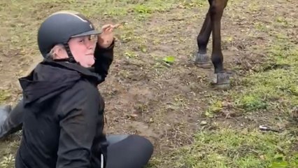 Rider thrown to ground as horse bucks unexpectedly during ride