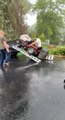 Man and Lawn Mower Fall as Ramp Slips Off