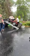 Man and Lawn Mower Fall as Ramp Slips Off