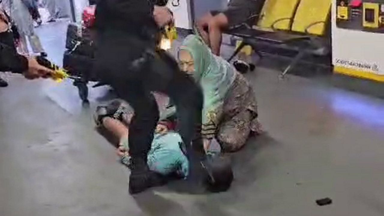Video shows police officer 'stamping on man's head' after tasering him at airport