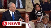 Rep. Rashida Tlaib holds 'war criminal' sign as Netanyahu speaks