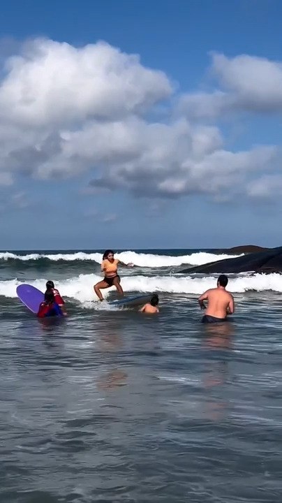 Girl Accidentally Hits Boy With Surfboard on First Surfing Lesson