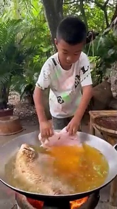 Little boy making a fish