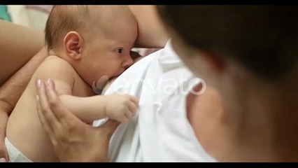 young mother breastfeed her newborn baby atb home cozy footage caring  Togetherness motherhood.