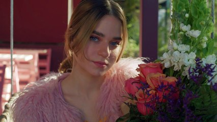 mixkit-girl-in-love-smells-a-bouquet-of-flowers-42596-hd-ready