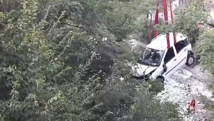Woman and two children rescued as car falls from bridge in Italy