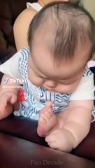 Cute baby sucking his toe