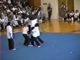 Kid Falls on Team Mates Crotch During High School Performance