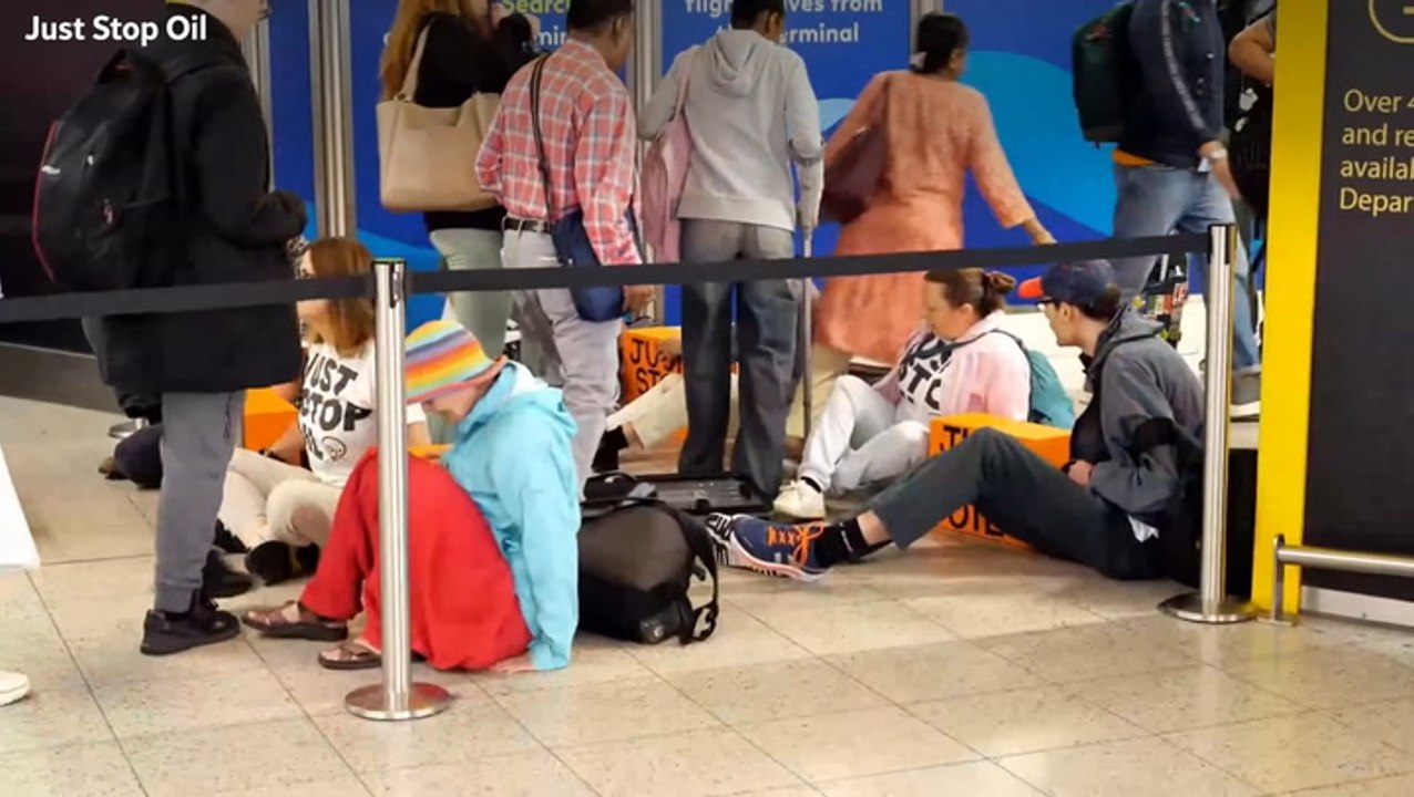 Gatwick passengers step over Just Stop Oil activists blocking airport entrance