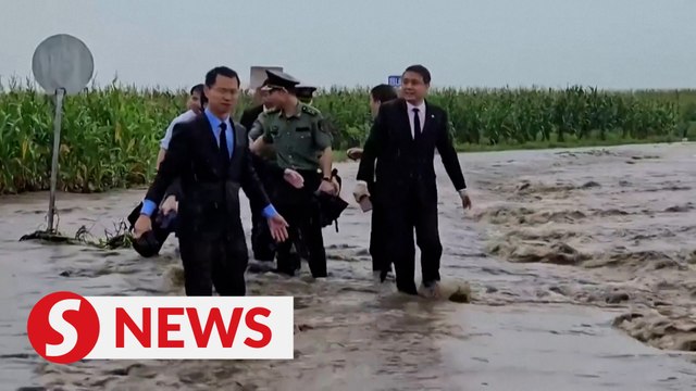 China's ambassador to North Korea drenched during visit to flooded county
