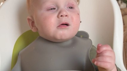 Sleep vs. dinner: Little guy battles his way through a plate of food