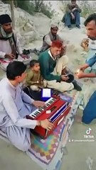 At Sehwan Sharif performing a Sufi song