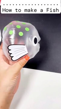 Watch as I transform a simple plastic bag into an adorable fish! Start by sealing the bag with a hair band...Inflate the bag with air and seal it again. Cut out and attach fins and eyes to give it character. In just a few easy step