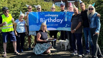 Fed up residents hold 'unhappy second birthday' party - for water leak