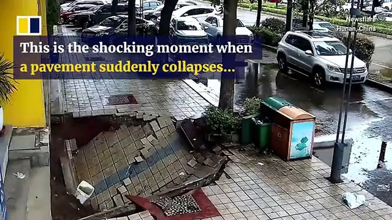 Deep sinkhole forms after pavement in China collapses. Deep sinkhole forms after pavement in China collapses