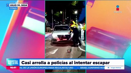 ¡Automovilista casi arrolla a policías al intentar escapar!
