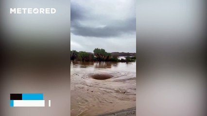 A large hole appears in the ground after torrential rains in Jazan, Saudi Arabia