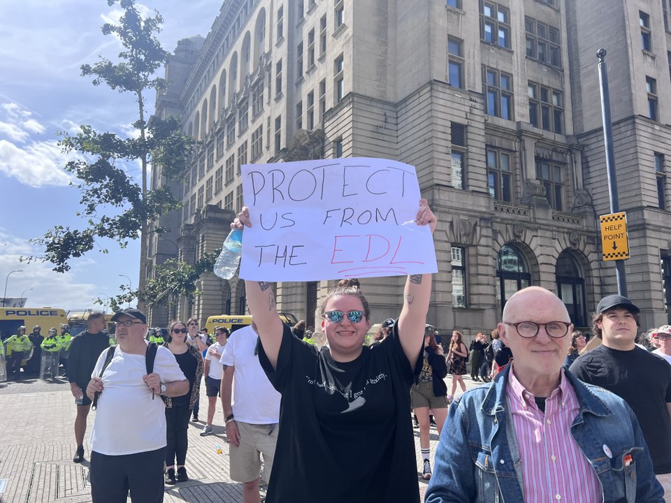 Anti-racism protestors chant 'Liverpool is anti fascist' as anti-immigration protestors look on