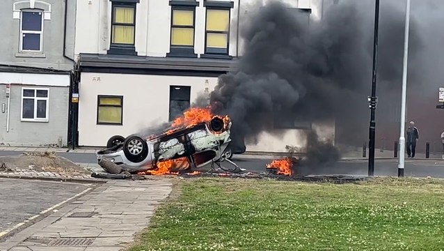 Car set alight after clashes between police and far-right rioters in Middlesbrough