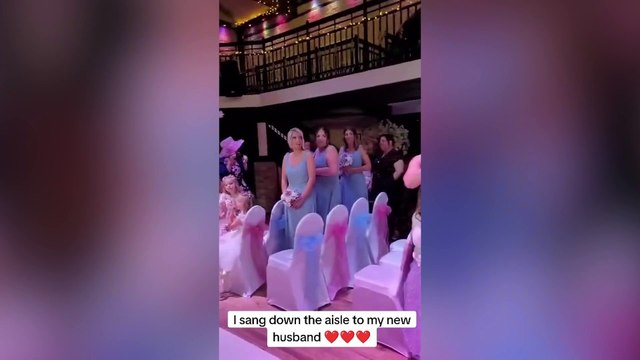 Bride surprised her groom at their wedding by singing as she walked down the aisle
