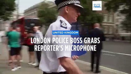 London Met Police Commissioner grabs microphone from reporter's hand